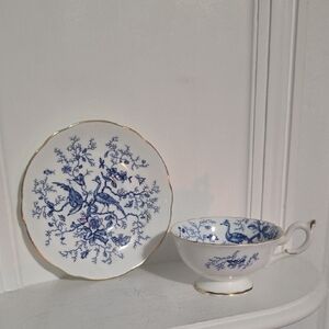 This is a vintage Coalport bone china teacup and saucer in the "Cairo" pattern,
